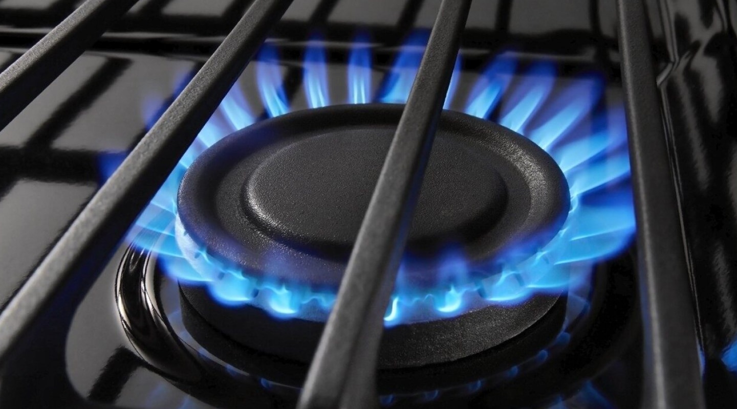 Blue flames ignited on a gas burner. Blue flames ignited on a gas burner.