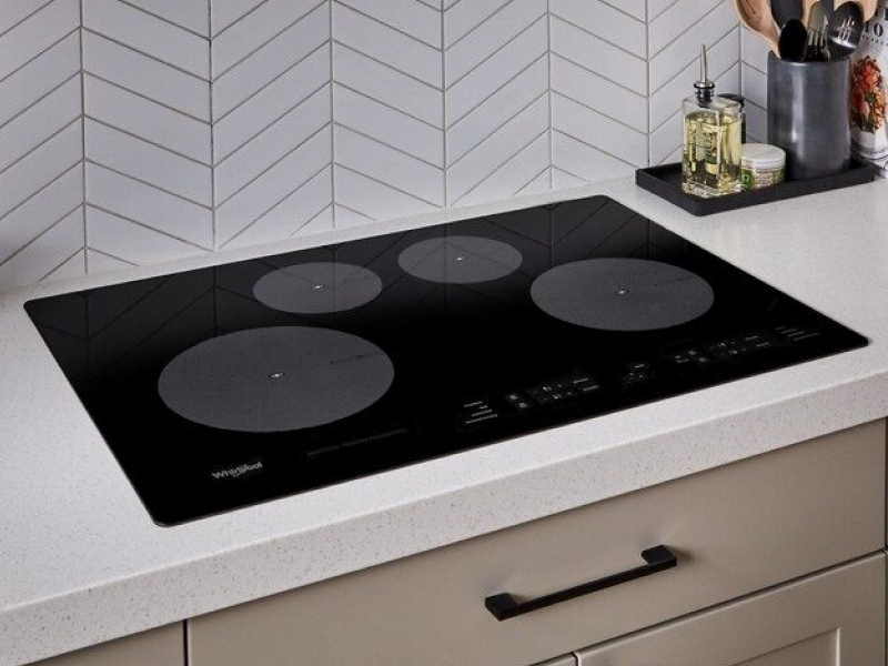 Picture of a Whirlpool® induction cooktop in a kitchen Picture of a Whirlpool® induction cooktop in a kitchen