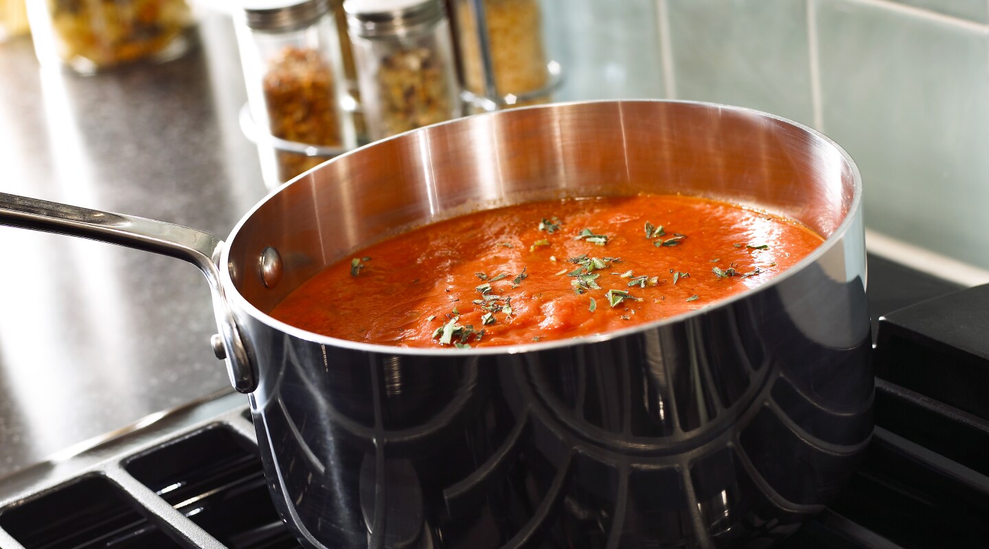 Stainless steel pan simmering on a Whirlpool® Gas Range Stainless steel pan simmering on a Whirlpool® Gas Range