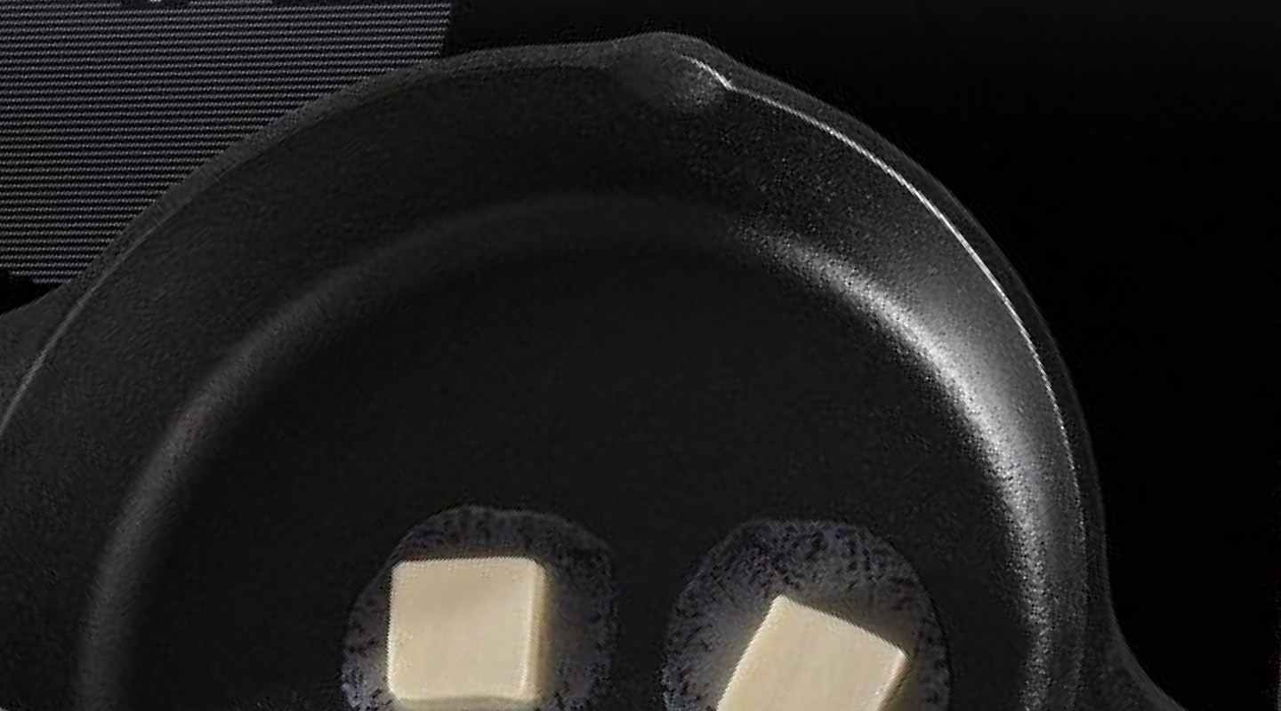 Cast iron skillet with melting butter inside Cast iron skillet with melting butter inside