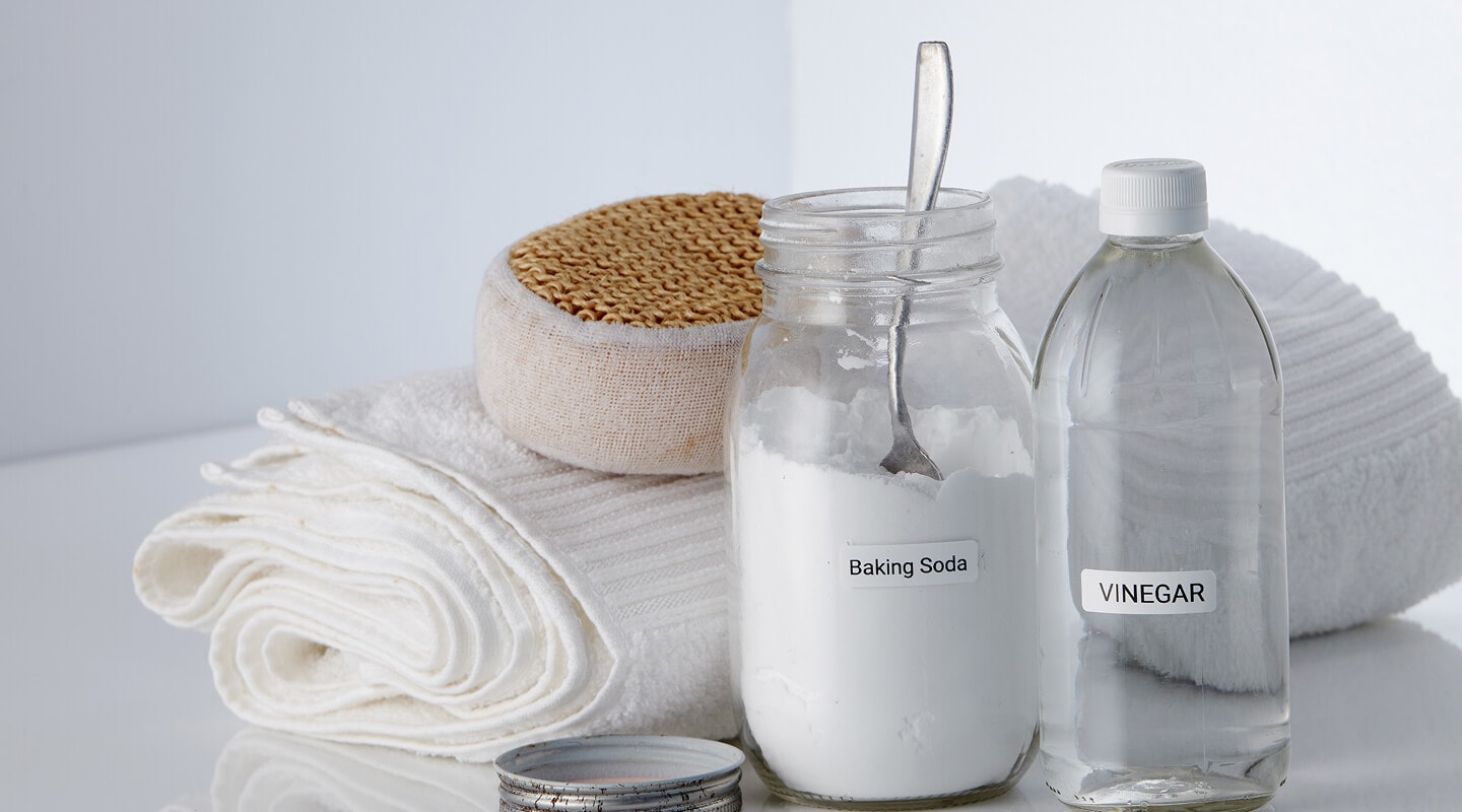  Baking soda and vinegar next to a towel