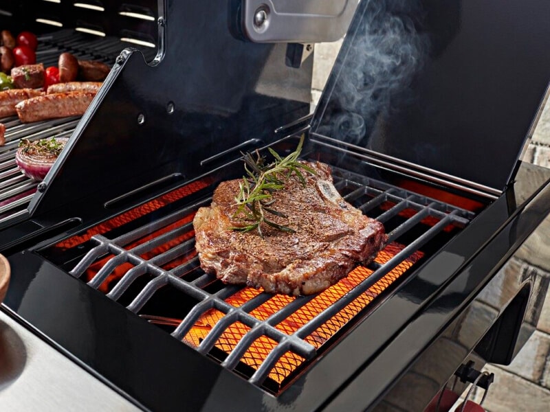 Steak with herbs on a grill