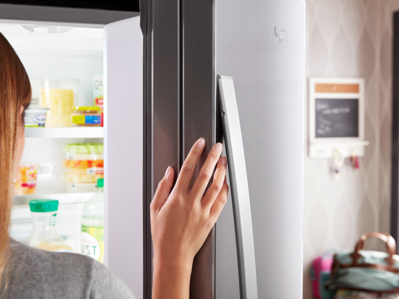 Person opening fridge Person opening fridge