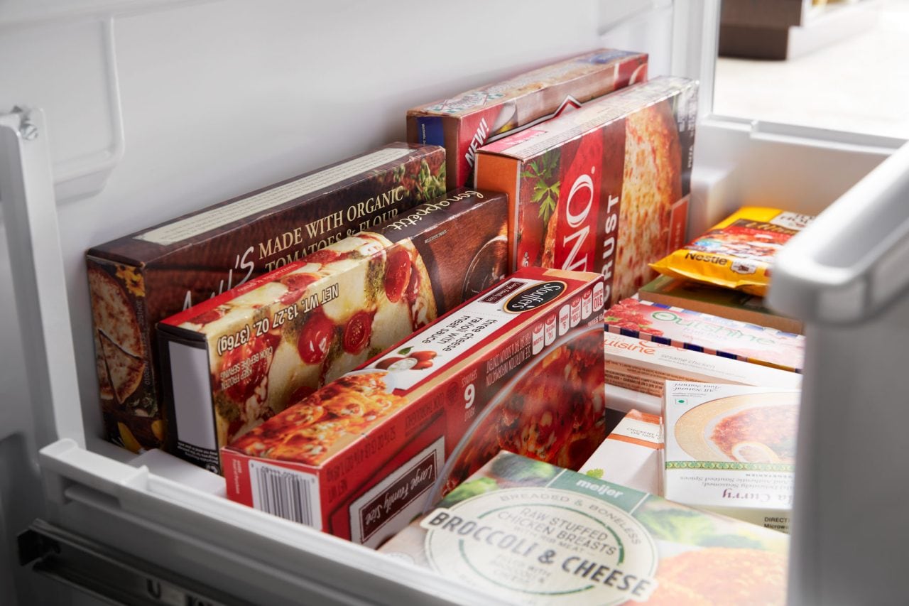 A container with food from a freezer A container with food from a freezer