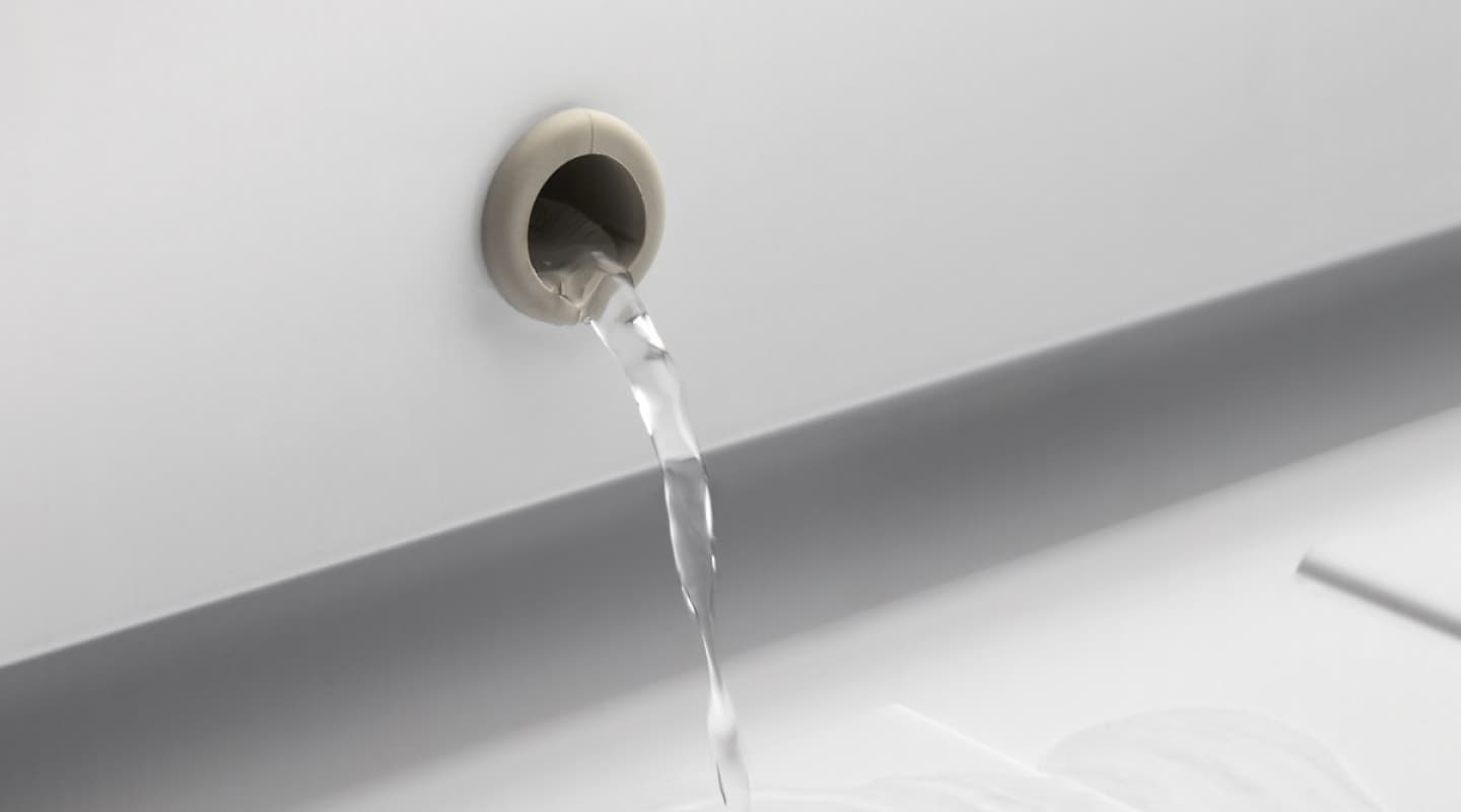 Water pouring from a drain Water pouring from a drain