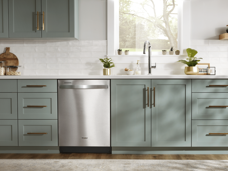 Stainless steel Whirlpool® top control dishwasher in a rustic kitchen Stainless steel Whirlpool® top control dishwasher in a rustic kitchen