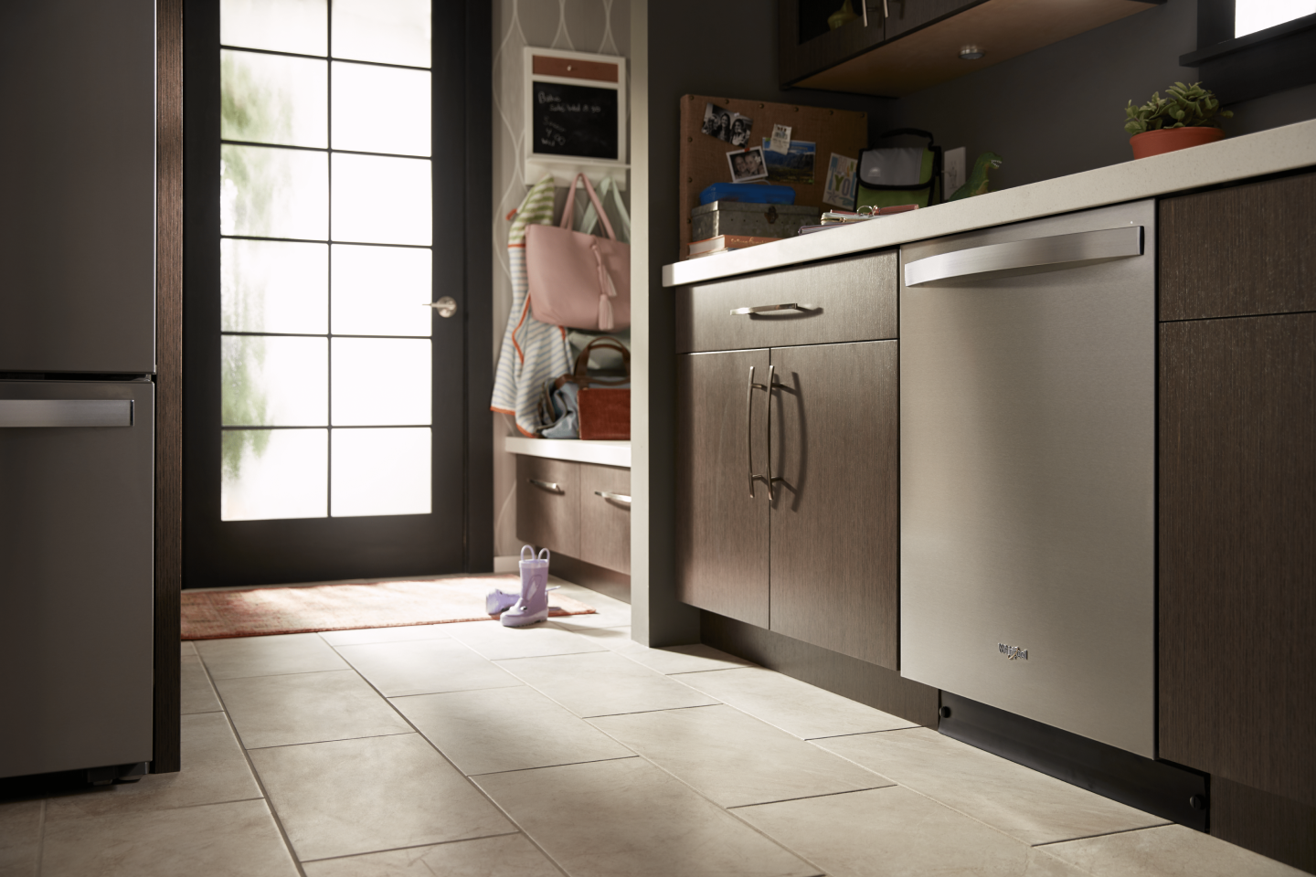 Stainless steel Whirlpool® top control dishwasher in a kitchen Stainless steel Whirlpool® top control dishwasher in a kitchen