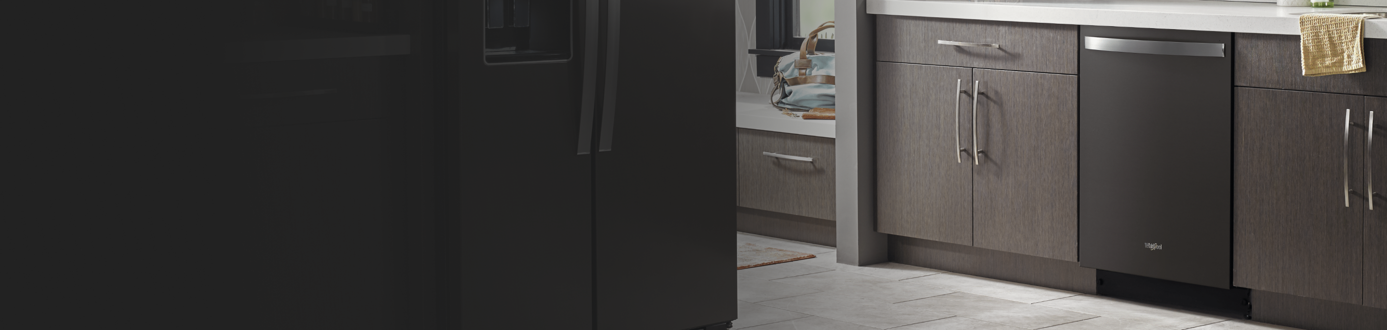 Gray kitchen cabinets outside of a laundry room