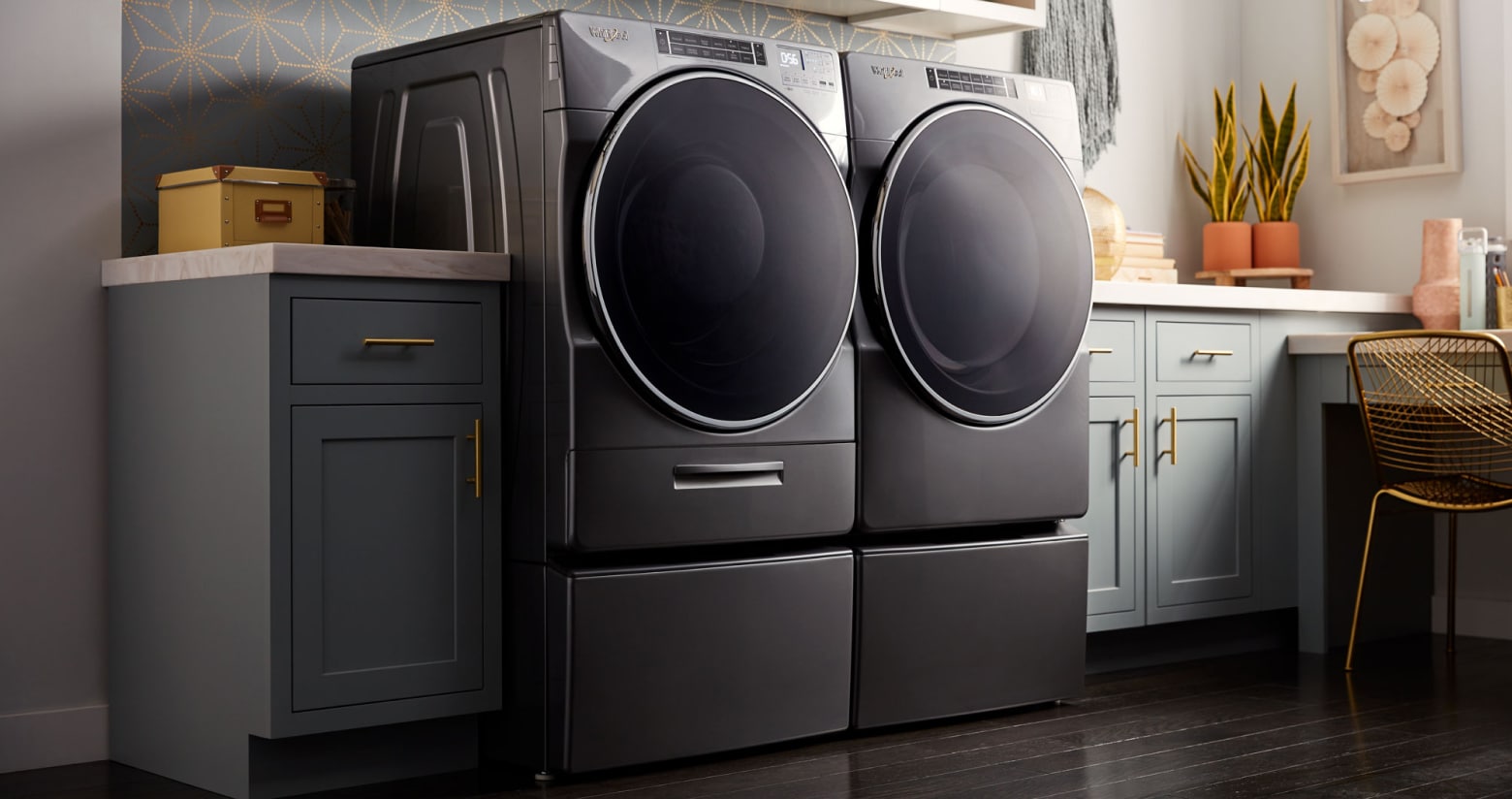 Whirlpool® front loading washer and dryer in a modern laundry room Whirlpool® front loading washer and dryer in a modern laundry room