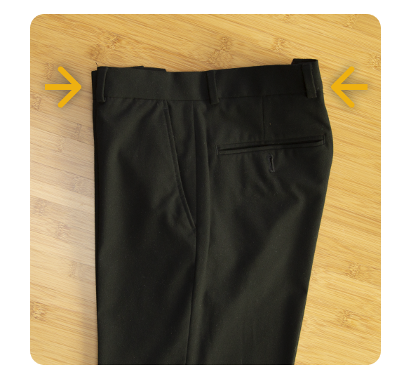 Creased pants folded in half with arrows facing inward Creased pants folded in half with arrows facing inward