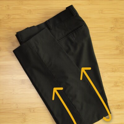 Pants folded in half with arrows facing up