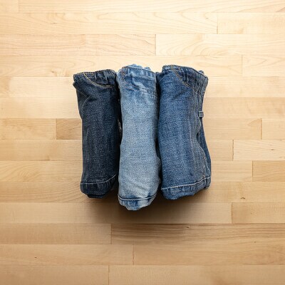 Three pairs of jeans stored as a standing rectangle