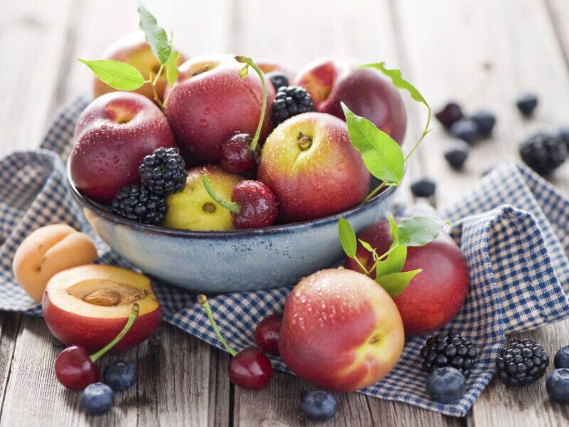A bowl of peaches, cherries and blackberries A bowl of peaches, cherries and blackberries