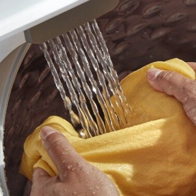 Clothing being rinsed with water