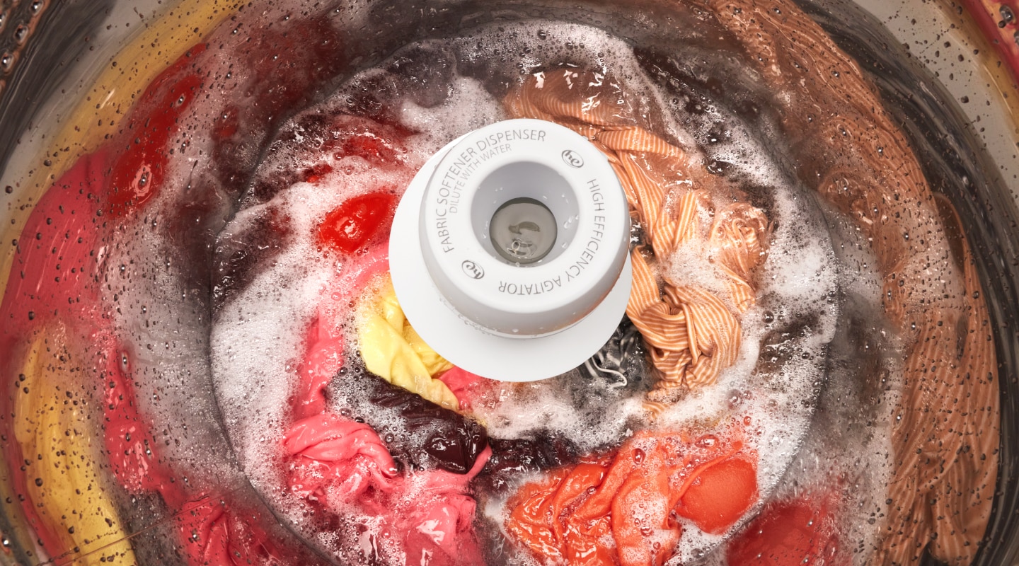Laundry lathering in detergent in a top-load washing machine Laundry lathering in detergent in a top-load washing machine