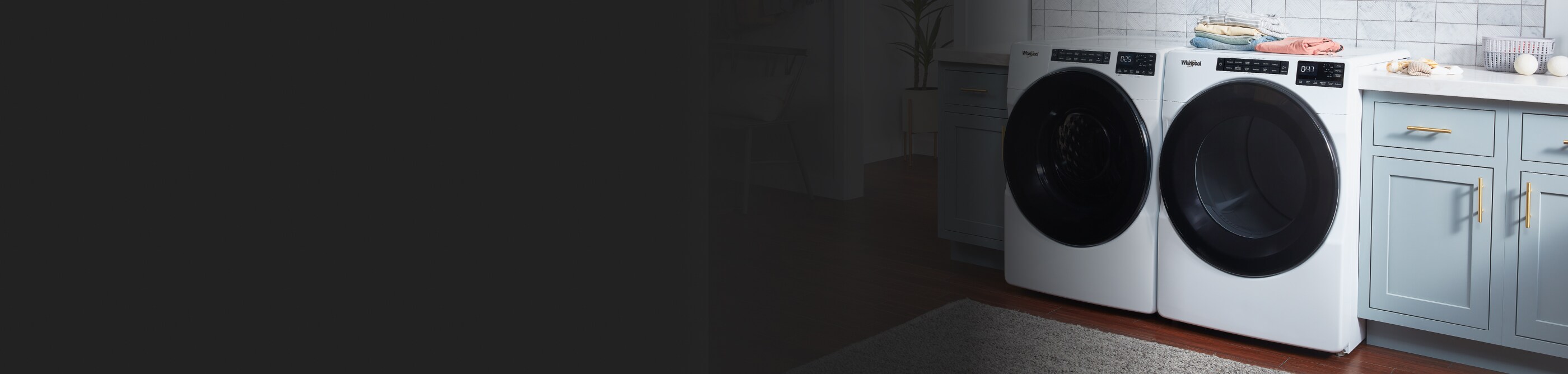 White front-load washer and dryer in a laundry room