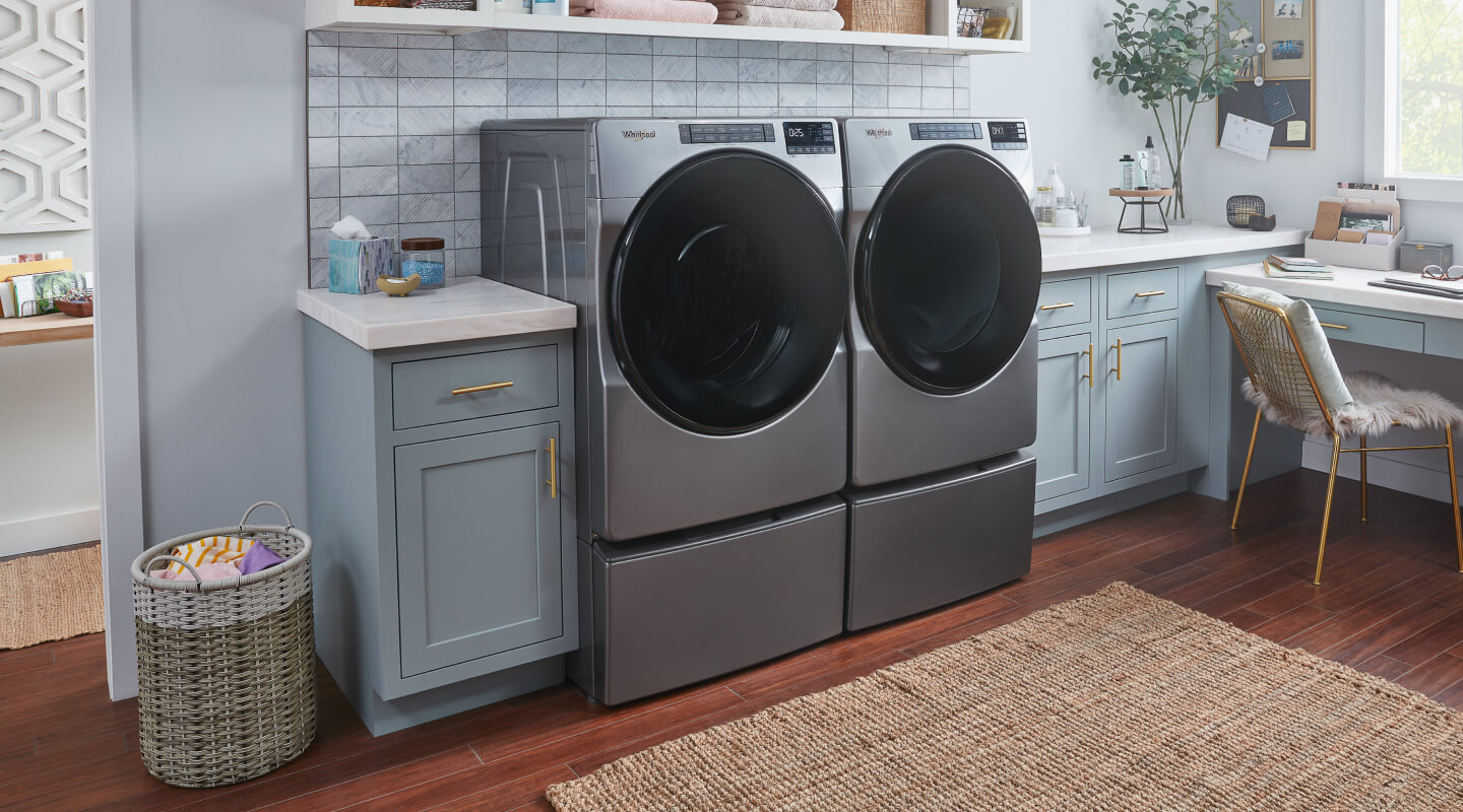 Whirlpool® Front Load Washer and Dryer in a laundry room Whirlpool® Front Load Washer and Dryer in a laundry room