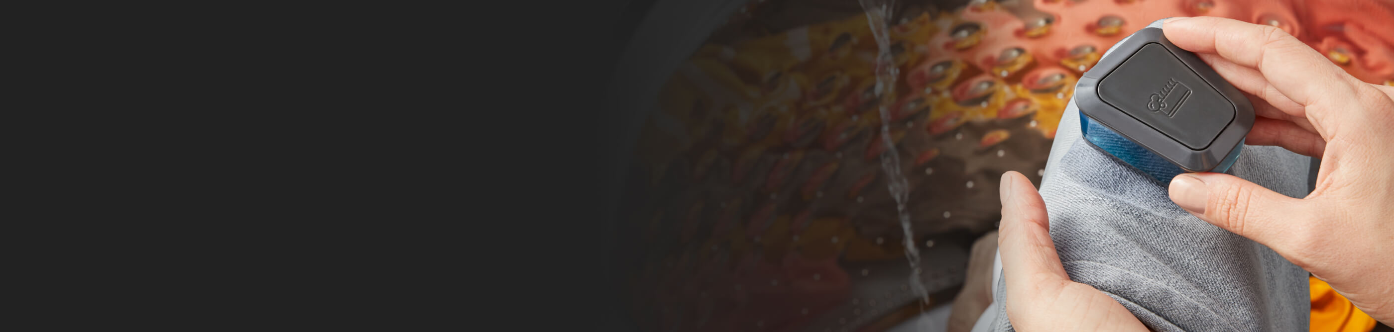 Person spot-treating a stain on fabric