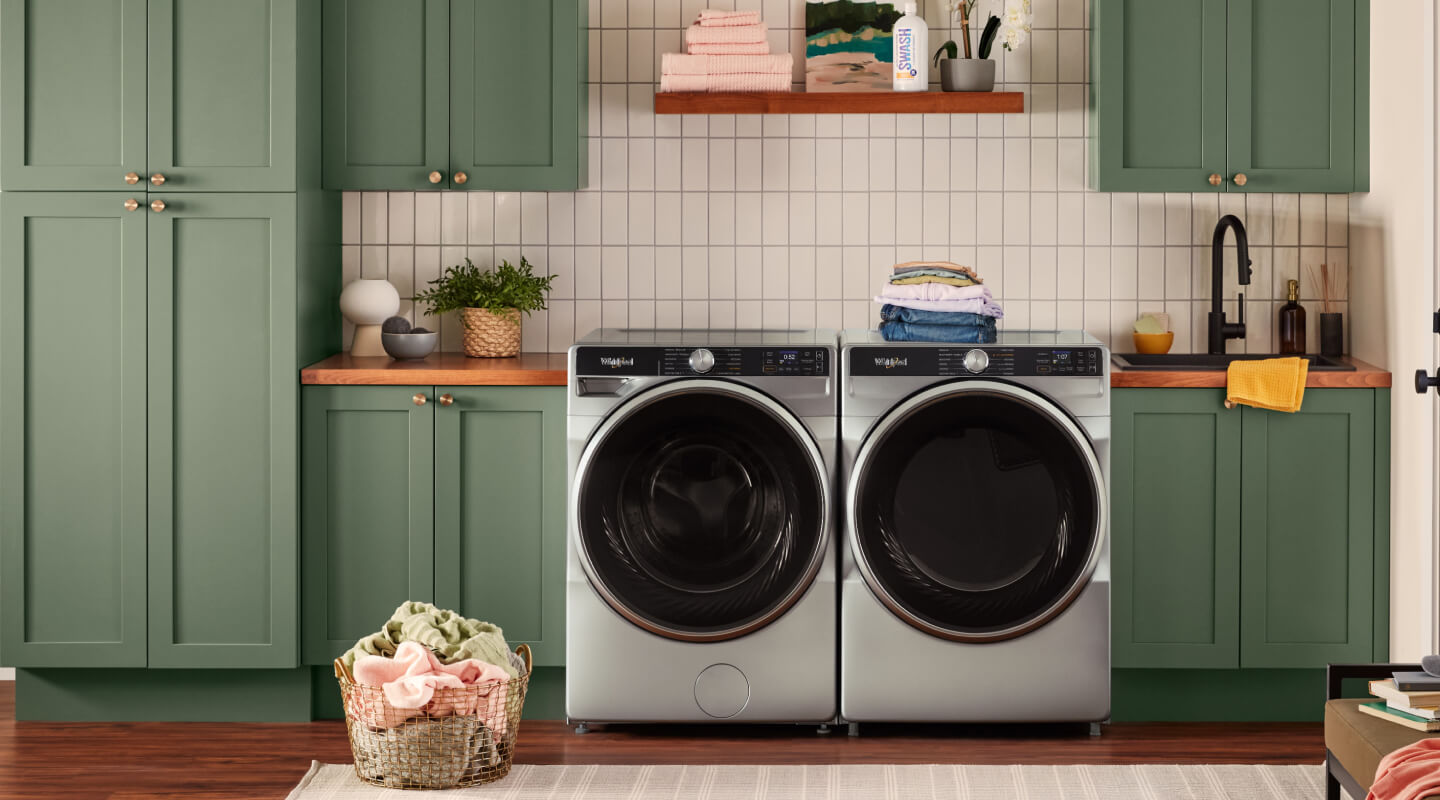 A laundry room with a Whirlpool® Front Load Washer and Dryer