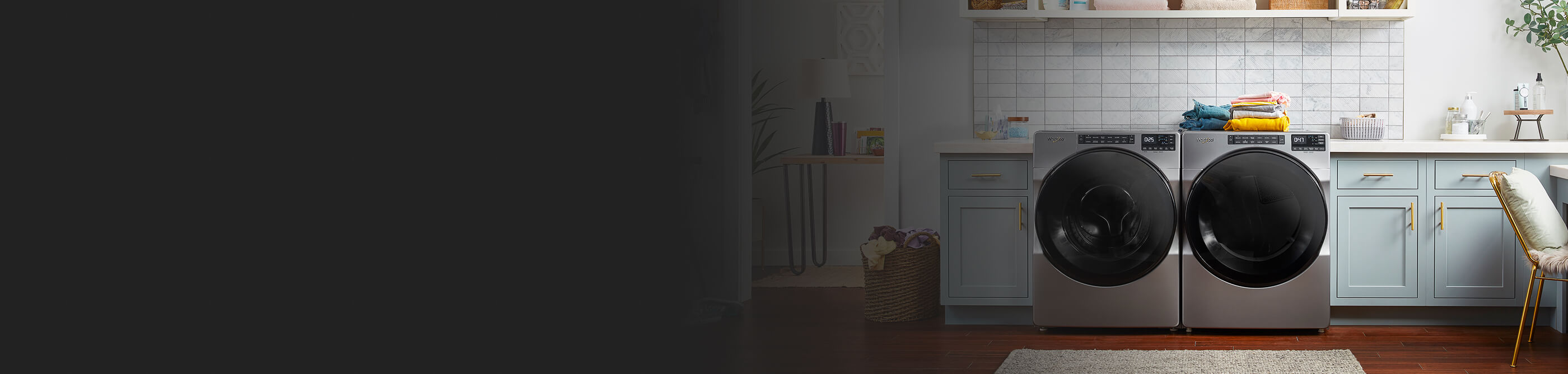 A laundry area with a Whirlpool® Front Load Washer and Dryer set