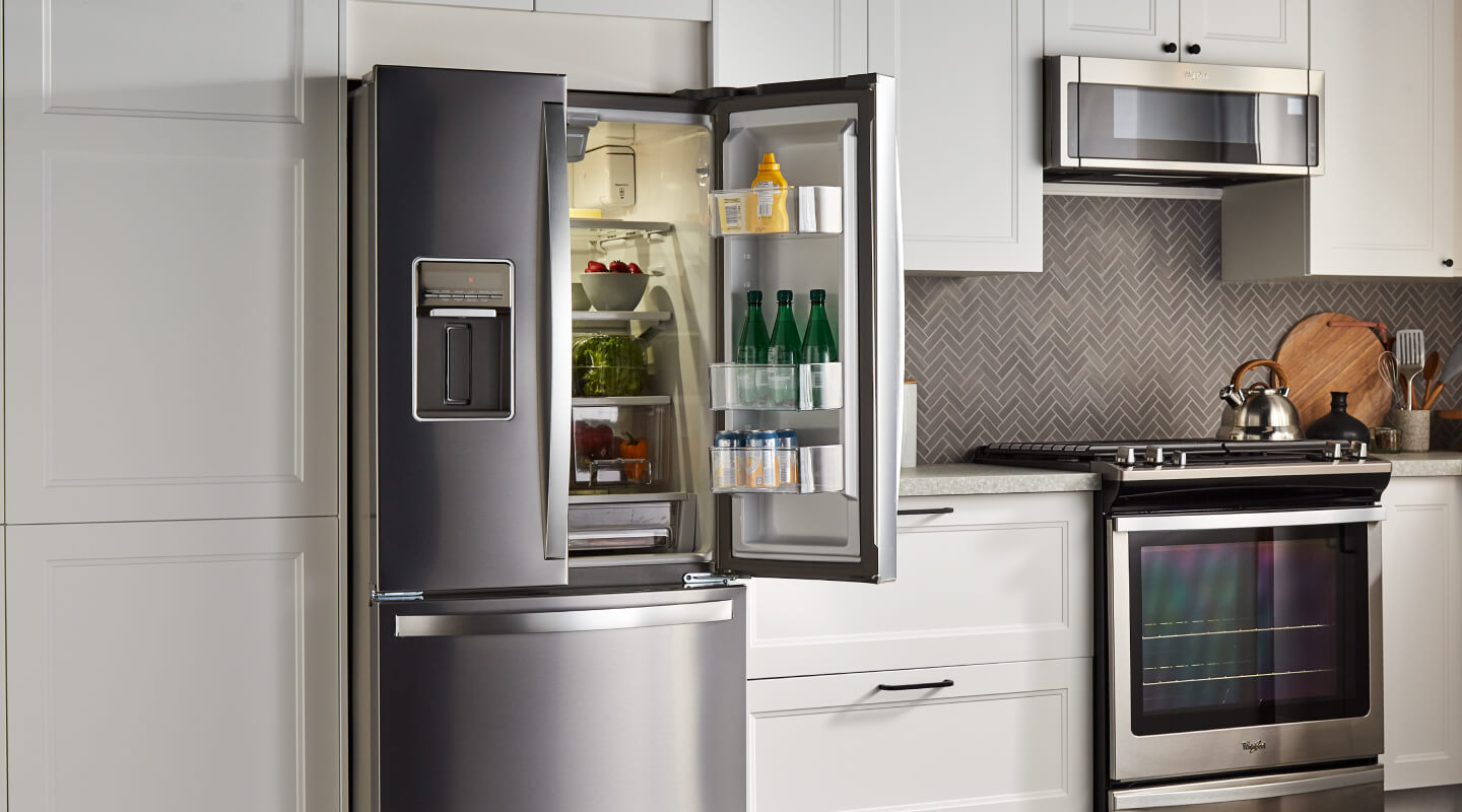 Open French door refrigerator in a modern kitchen