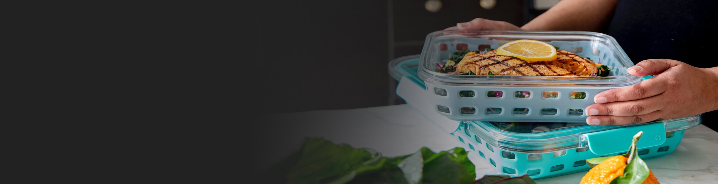 Hand stacking containers with prepped meals