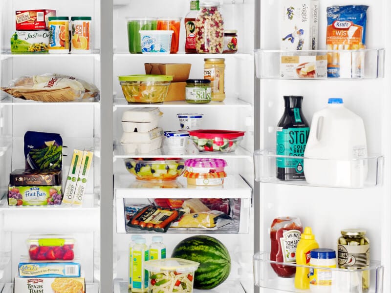 A closeup of the interior of a Whirlpool® side-by-side refrigerator with food and beverage items A closeup of the interior of a Whirlpool® side-by-side refrigerator with food and beverage items