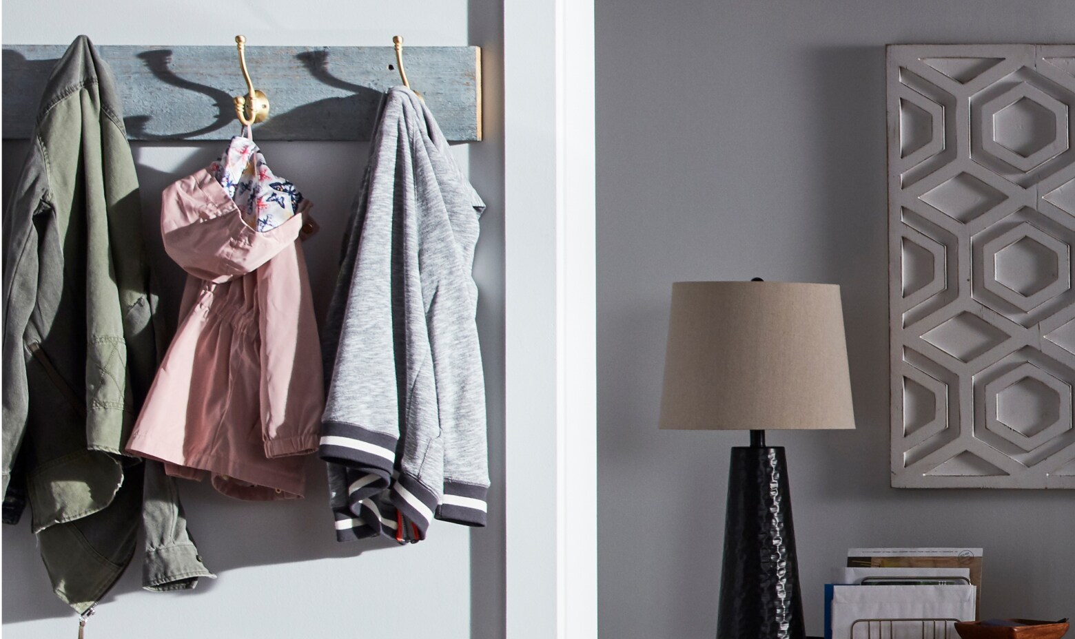 Clothes hanging on a rack in modern living room Clothes hanging on a rack in modern living room