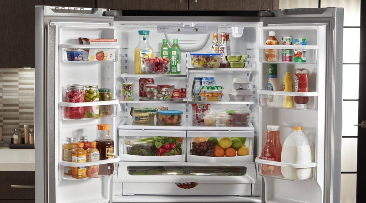 Both doors open, showing the inside of a Whirlpool® Refrigerator Both doors open, showing the inside of a Whirlpool® Refrigerator