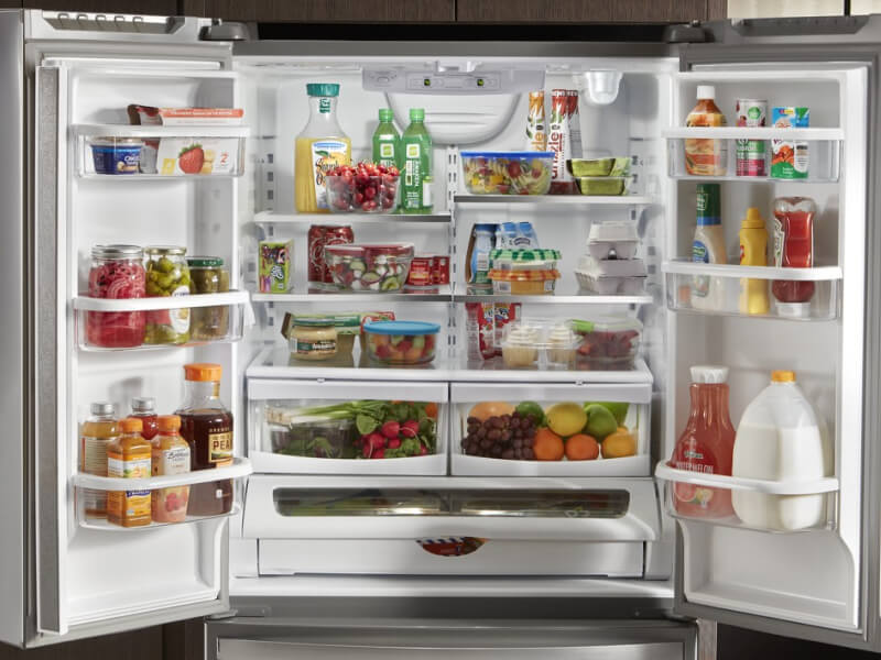 Both doors open, showing the inside of a Whirlpool® Refrigerator Both doors open, showing the inside of a Whirlpool® Refrigerator