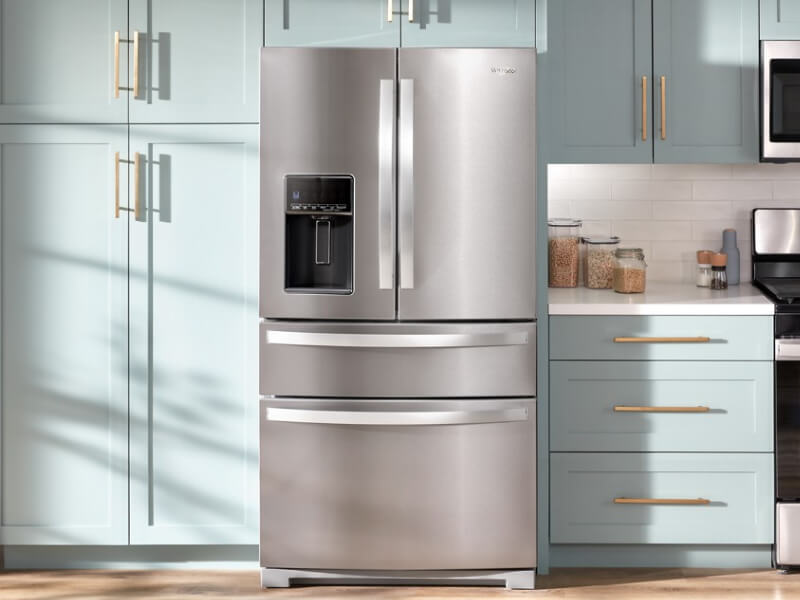 A kitchen with blue cabinets and Whirlpool® appliances A kitchen with blue cabinets and Whirlpool® appliances