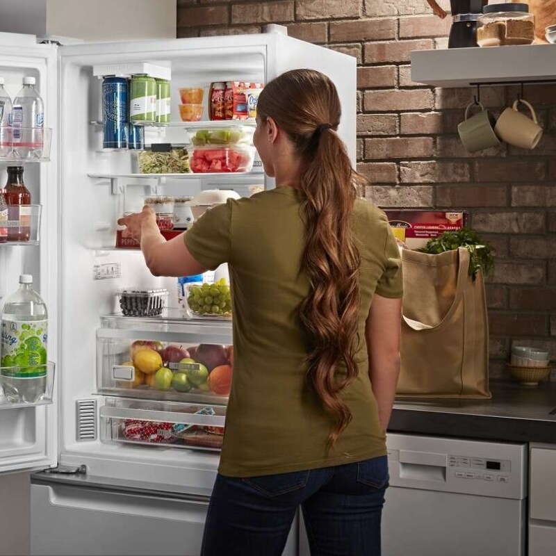 Person pulling ingredients from a fridge