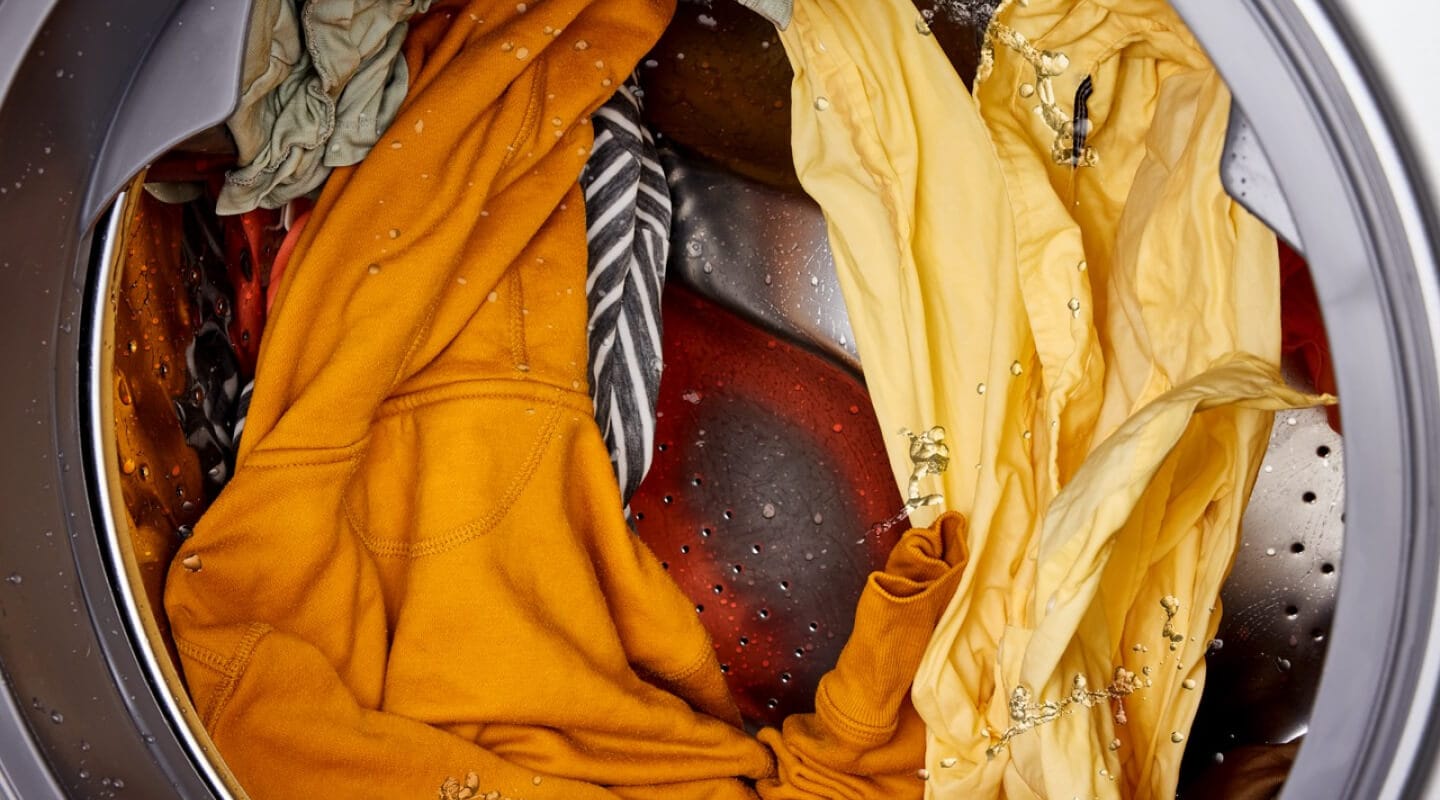 Colorful clothes in a washing machine Colorful clothes in a washing machine