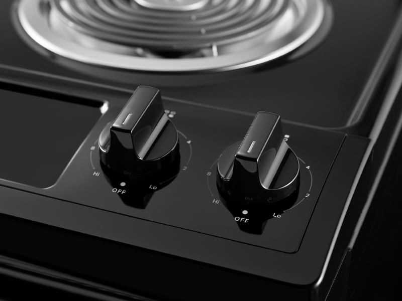 A closeup of the burner control knobs on a Whirlpool® electric range. A closeup of the burner control knobs on a Whirlpool® electric range.