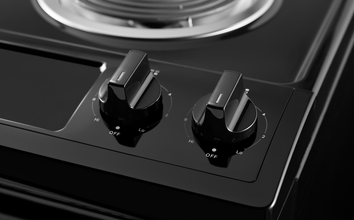 A closeup of the burner control knobs on a Whirlpool® electric range. A closeup of the burner control knobs on a Whirlpool® electric range.