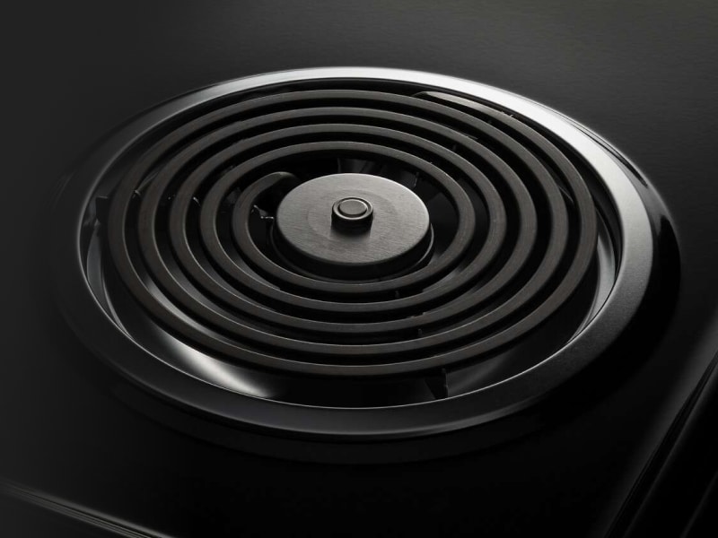 A closeup of an Amana® electric cooktop coil burner. A closeup of an Amana® electric cooktop coil burner.