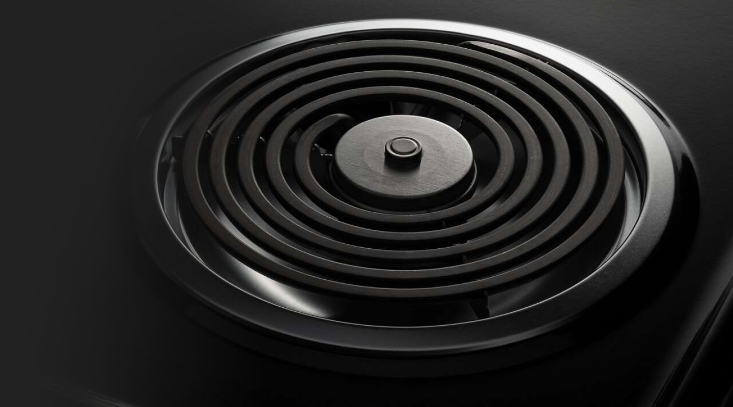 A closeup of an Amana® electric cooktop coil burner. A closeup of an Amana® electric cooktop coil burner.