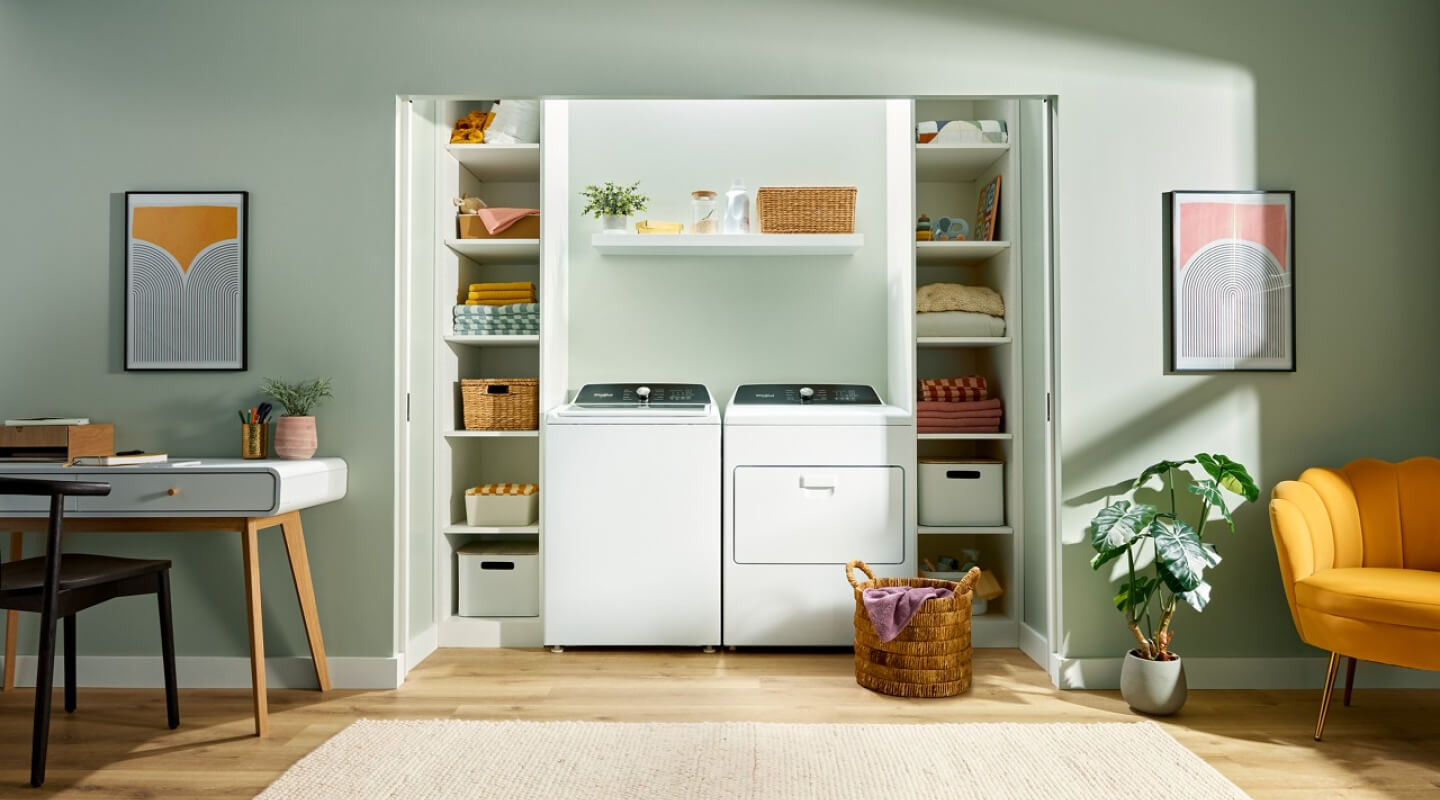 Laundry room with a white Whirlpool® Top Load Laundry Set Laundry room with a white Whirlpool® Top Load Laundry Set