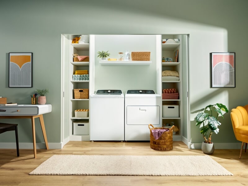 Laundry room with a white Whirlpool® Top Load Laundry Set