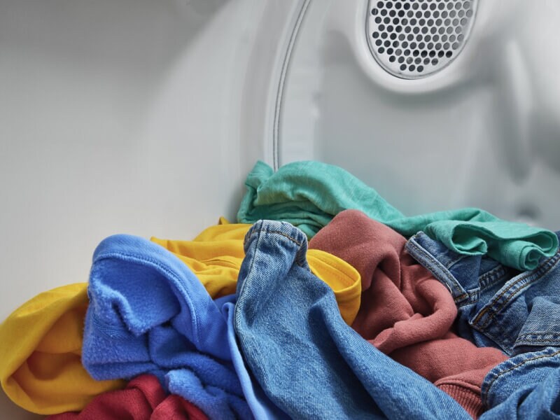 Colorful clothes in a dryer