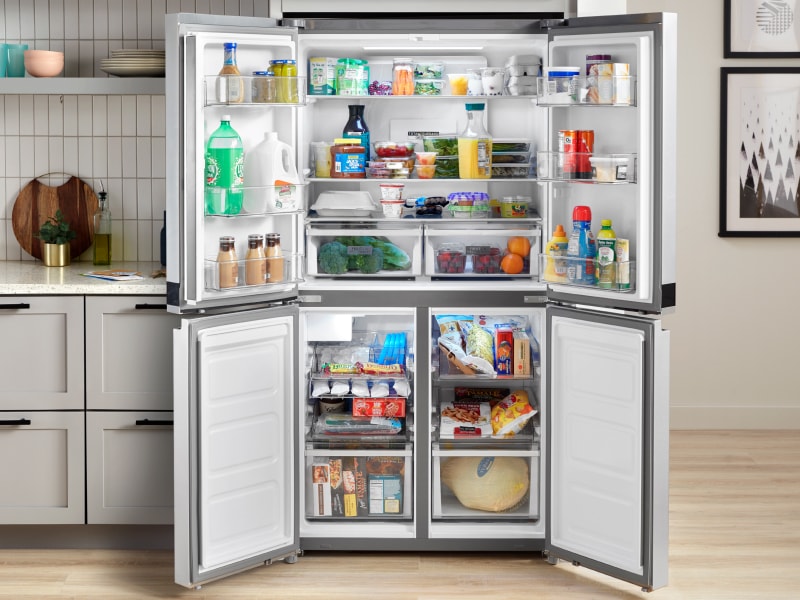 4 doors open on a refrigerator 4 doors open on a refrigerator