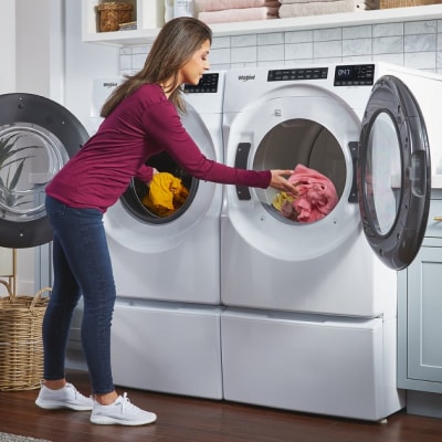 Person loading washer and dryer