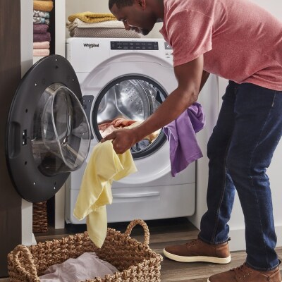 Person loading a washer