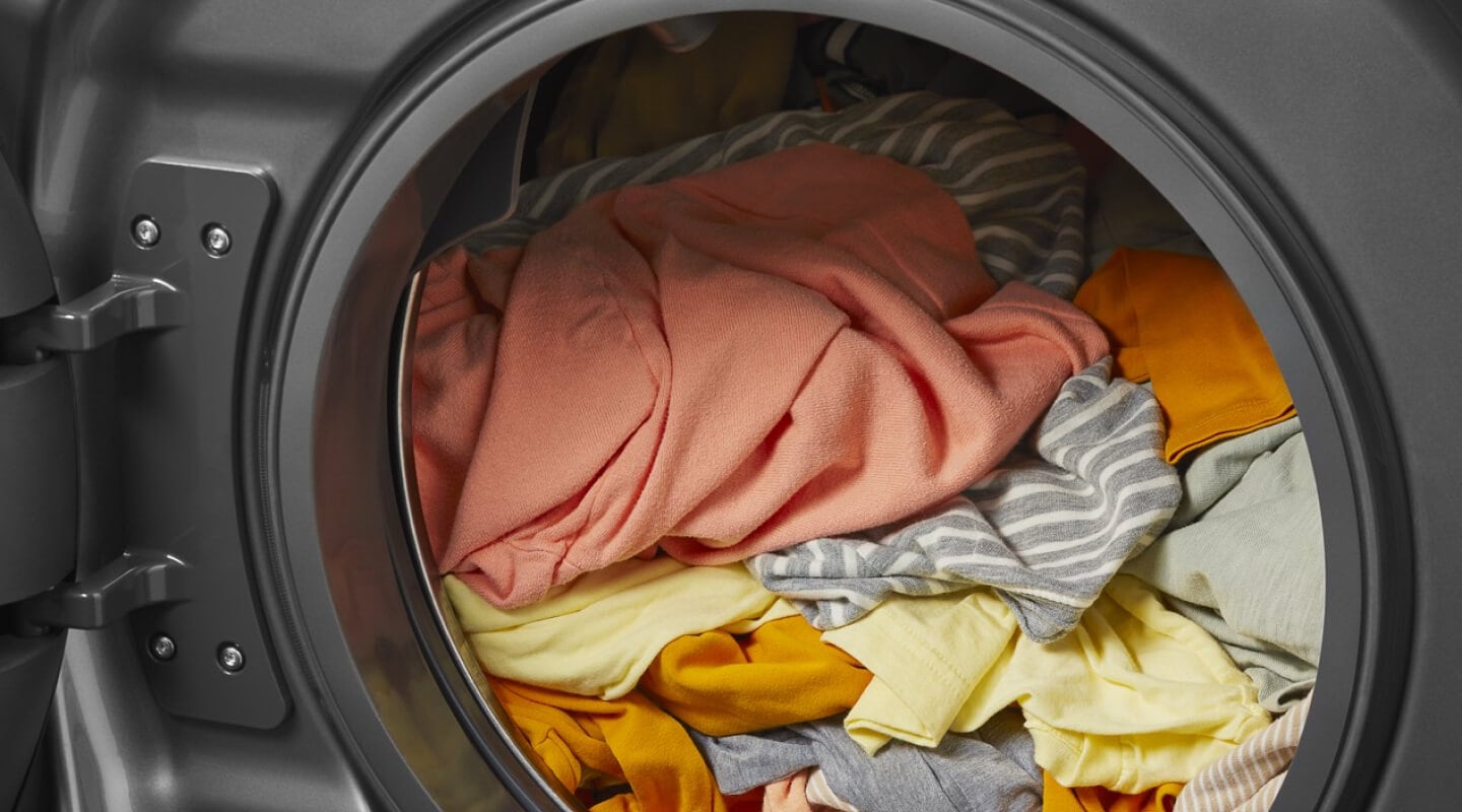 A washer filled with clothes A washer filled with clothes