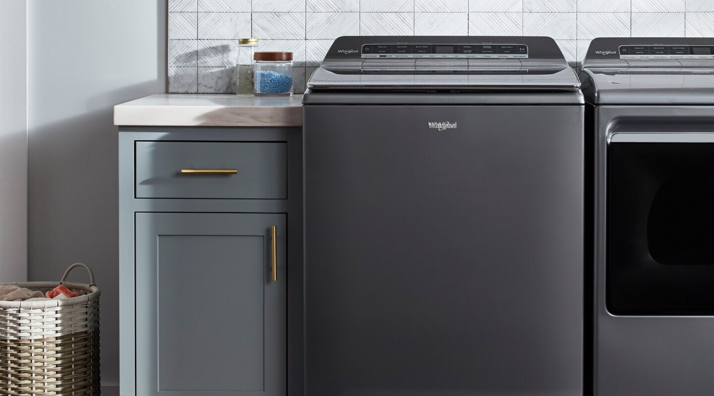 Top load Whirlpool® washer in a laundry room Top load Whirlpool® washer in a laundry room