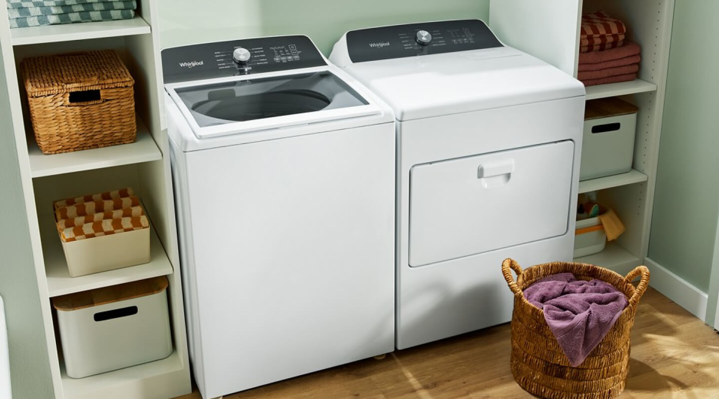 White Whirlpool® top load laundry pair in laundry room 
