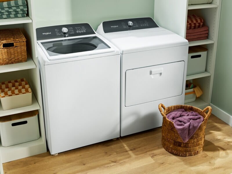 White Whirlpool® top load laundry pair in laundry room 