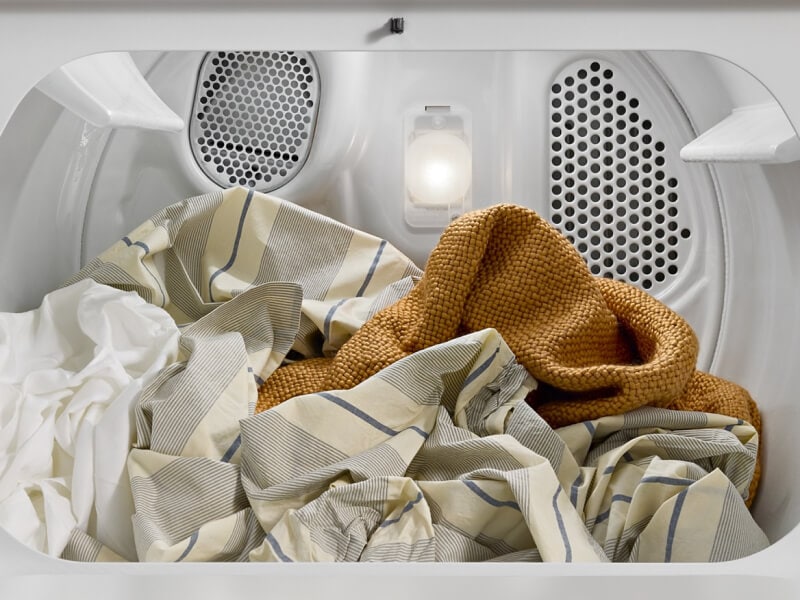 Clothes inside a dryer drum