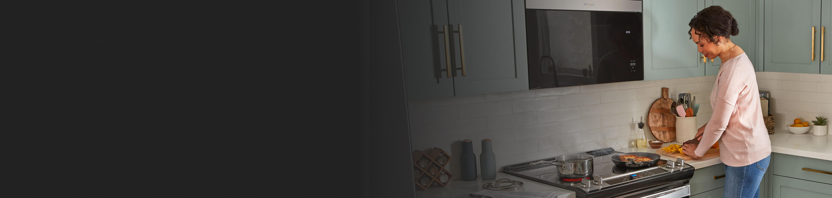 Person sautéing on an electric range