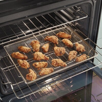 Food cooking in an air fryer basket